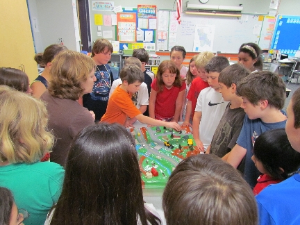 Tammy Gilpatrick & Clough Elementary students with Watershed Model